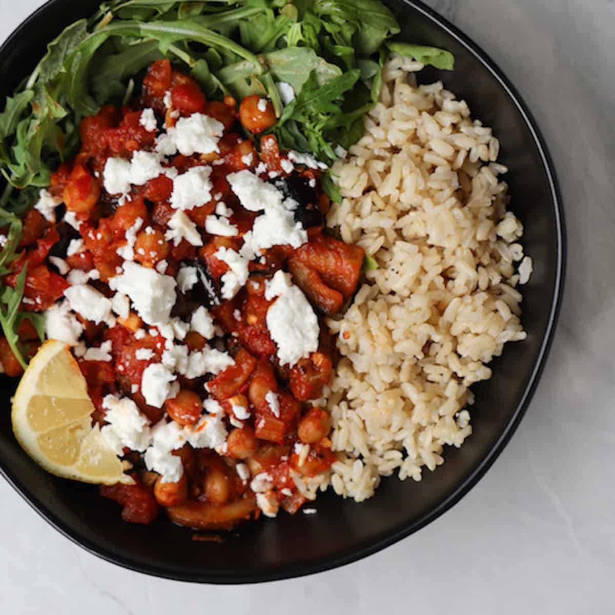 bowl of brown rice and harissa chickpea mix