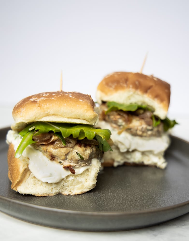 two juicy rosemary garlic turkey sliders on a plate