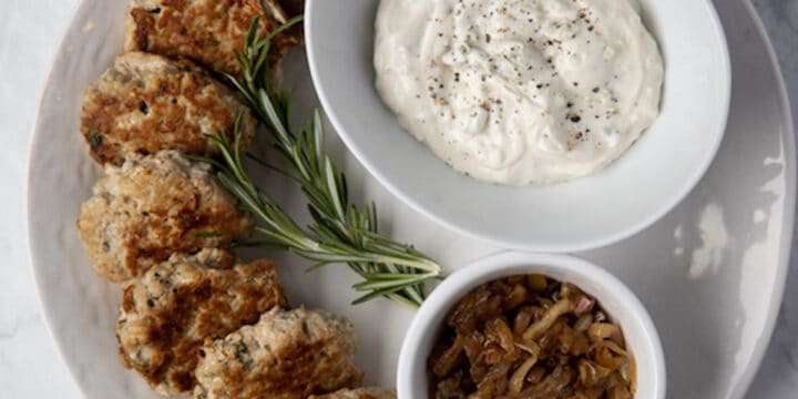 turkey slider patties on a platter with a bowl of gorgonzola mayo
