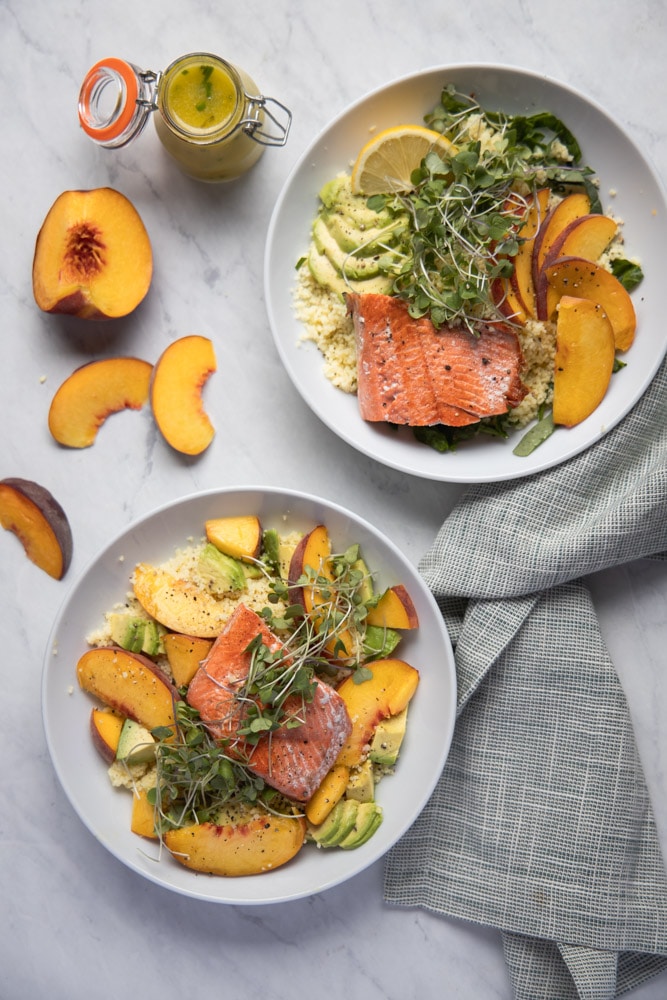 two salmon peach bowls on a table