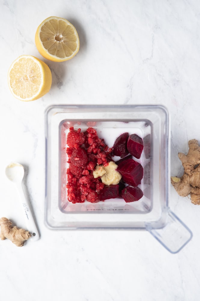overhead shot of smoothie ingredients in the blender