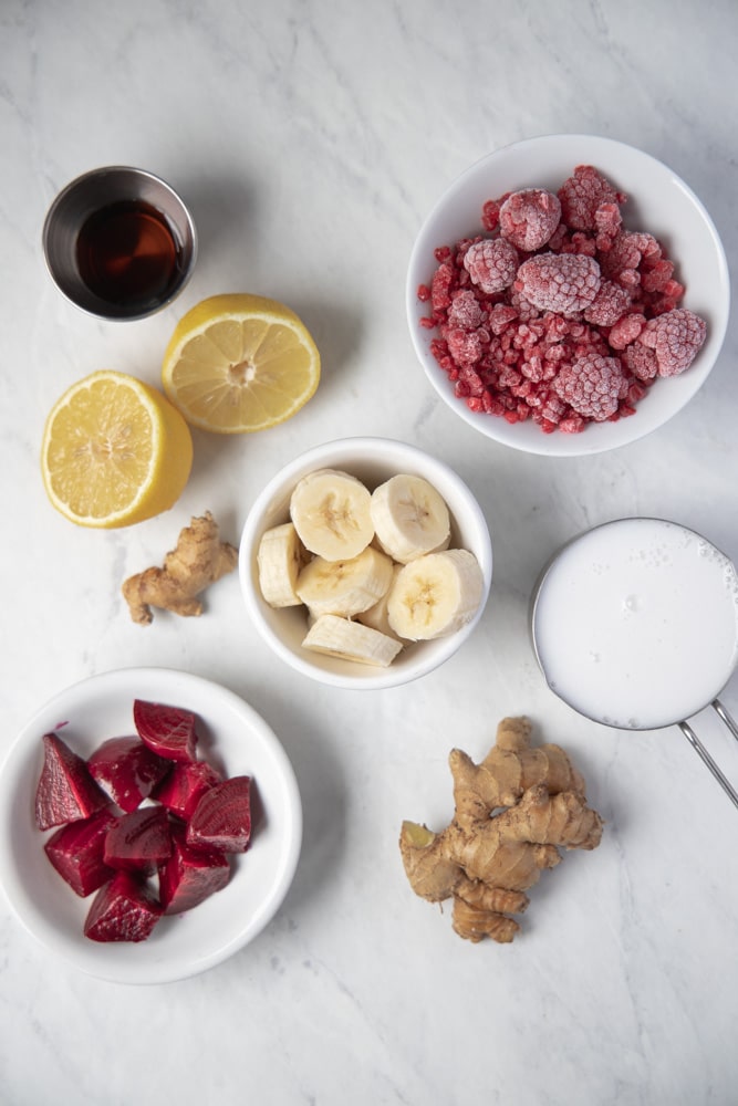 all the ingredients for the smoothie in individual bowls