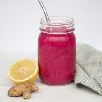 mason jar glass filled with beet smoothie
