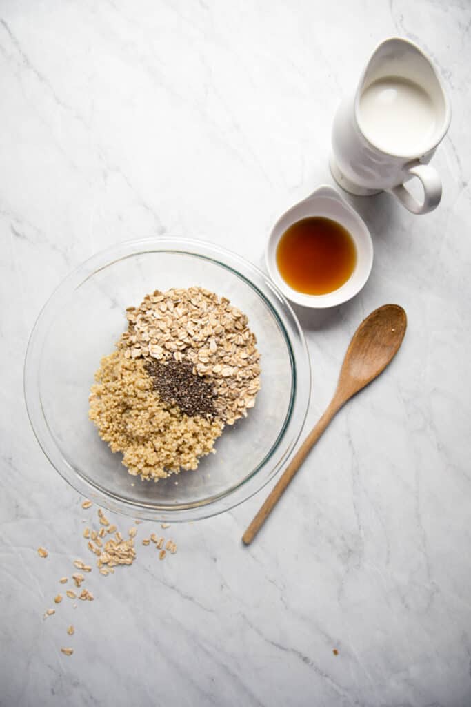 Ingredients to make protein overnight oats in bowls.
