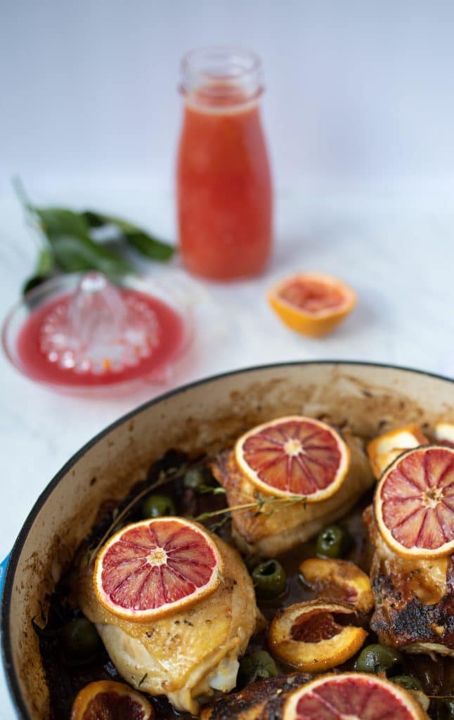 chicken thighs with blood oranges in a skillet