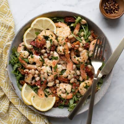platter with fresh arugula and shrimp mixture