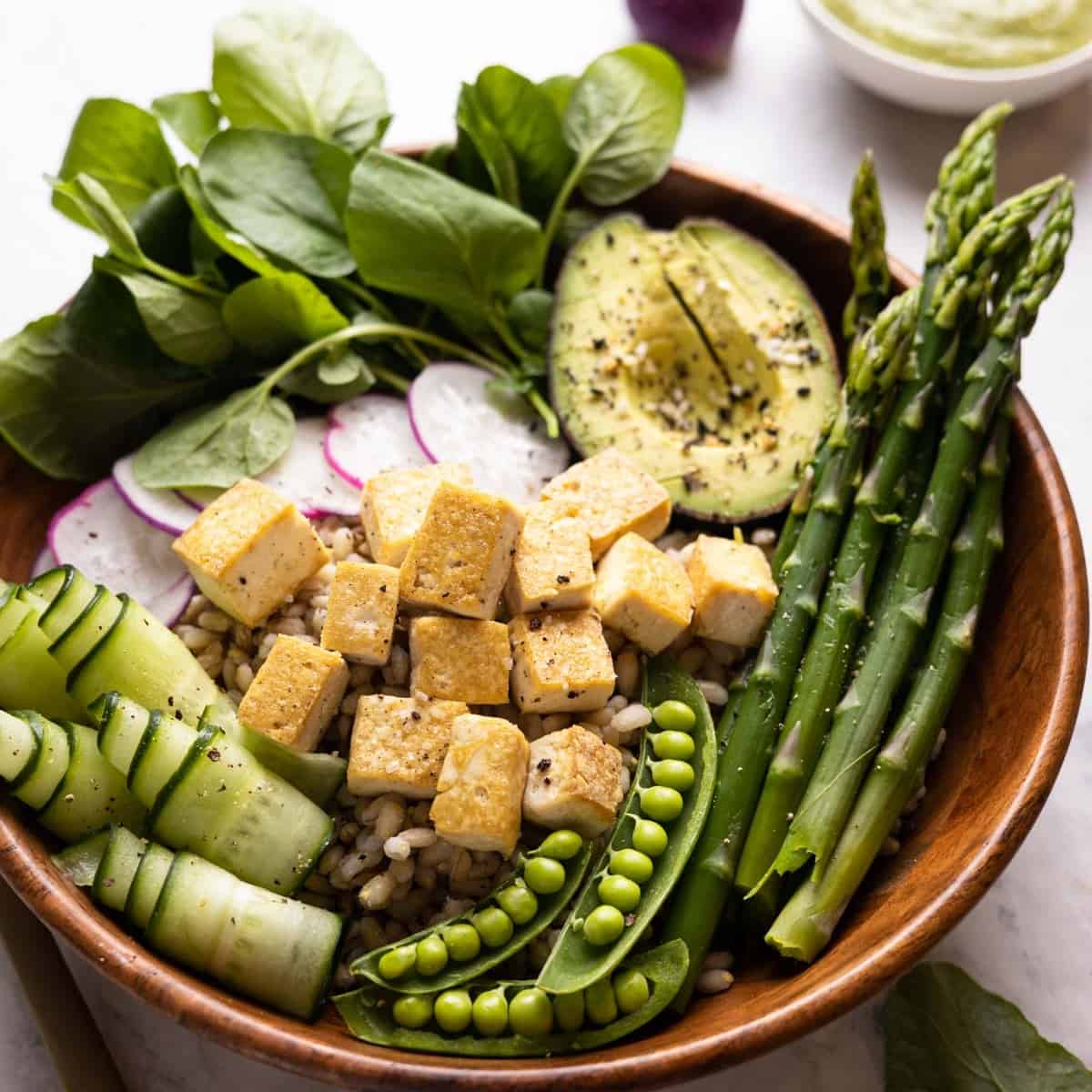 closeup image of grain bowl with ingredients layered