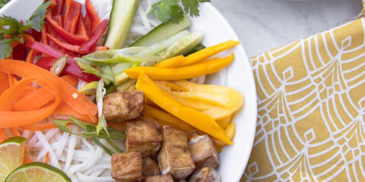 bowl of spring roll noodles, mango and crispy tofu