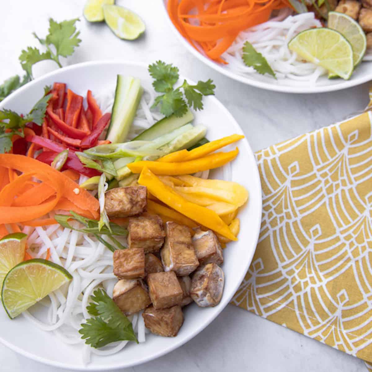 bowl of spring roll noodles, mango and crispy tofu