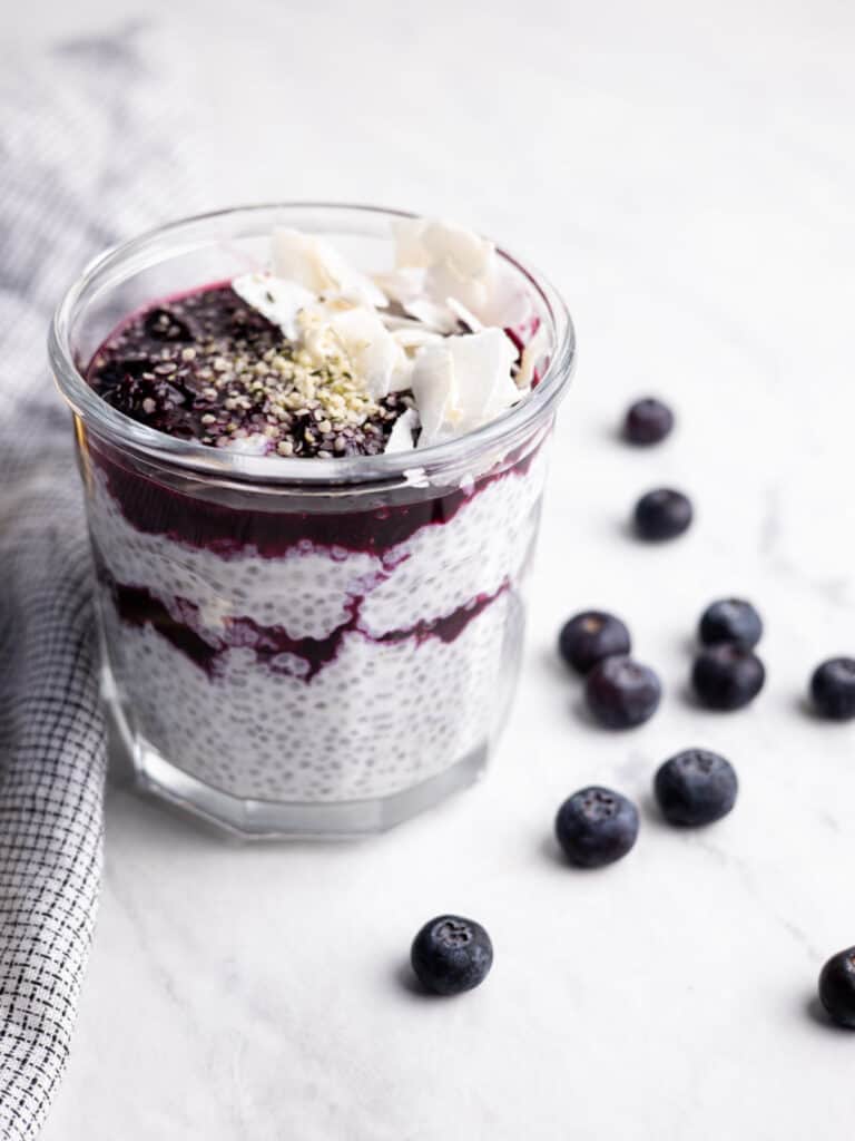 mason jar layered with chia pudding and blueberry compote