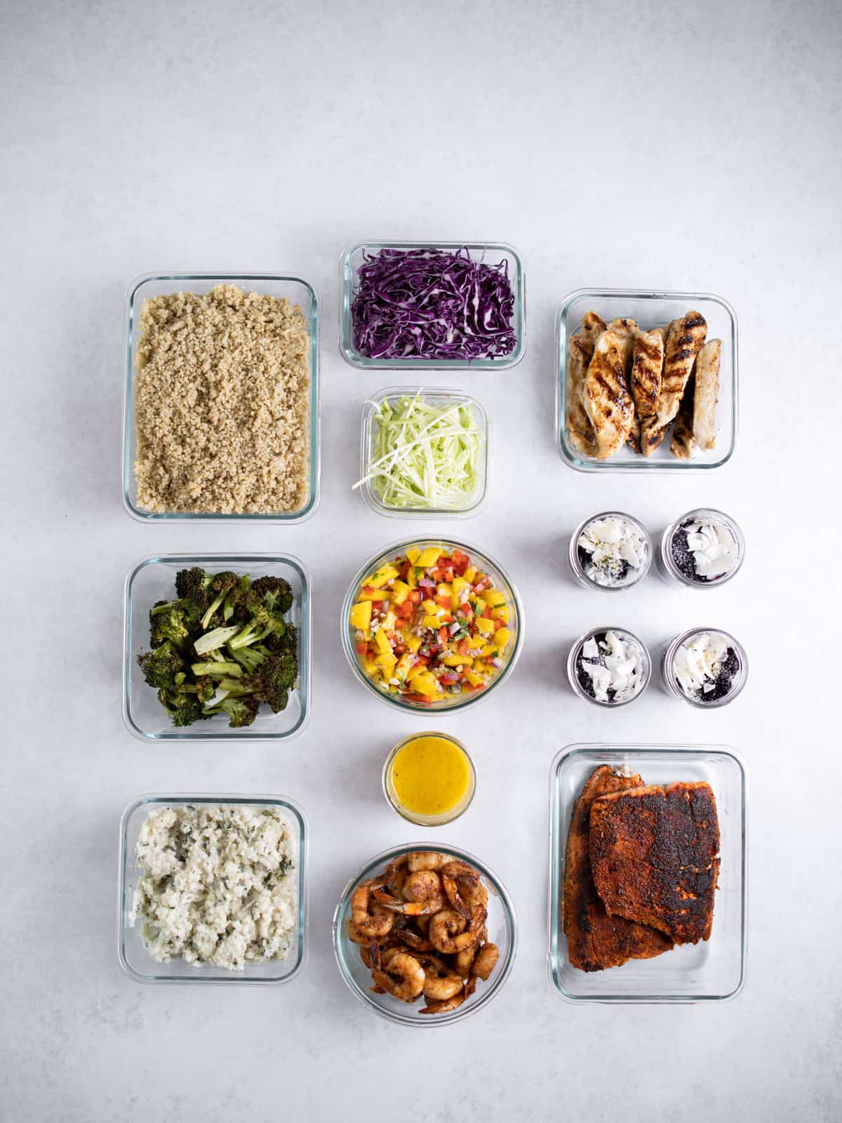 glass meal prep containers filled with ingredients