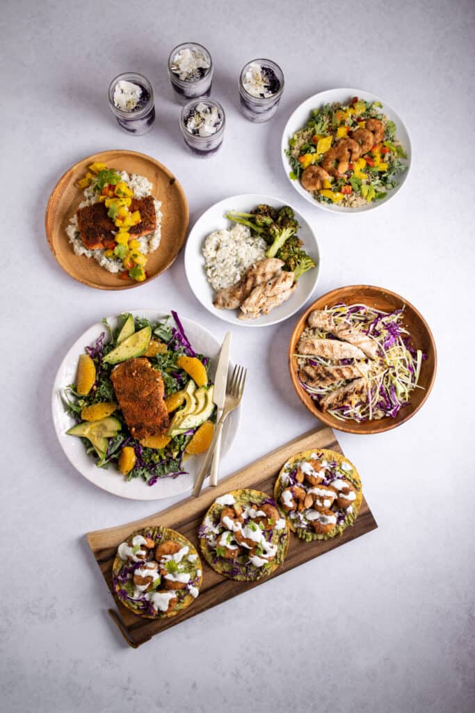 overhead shot of healthy summer meal prepped dishes