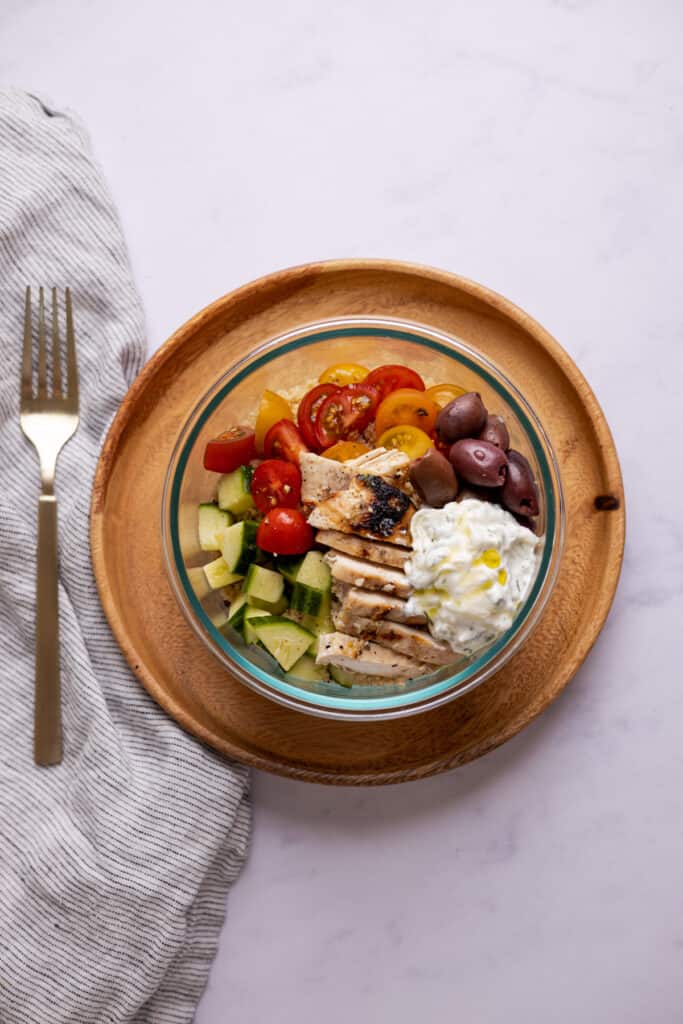 greek couscous bowl in a glass container