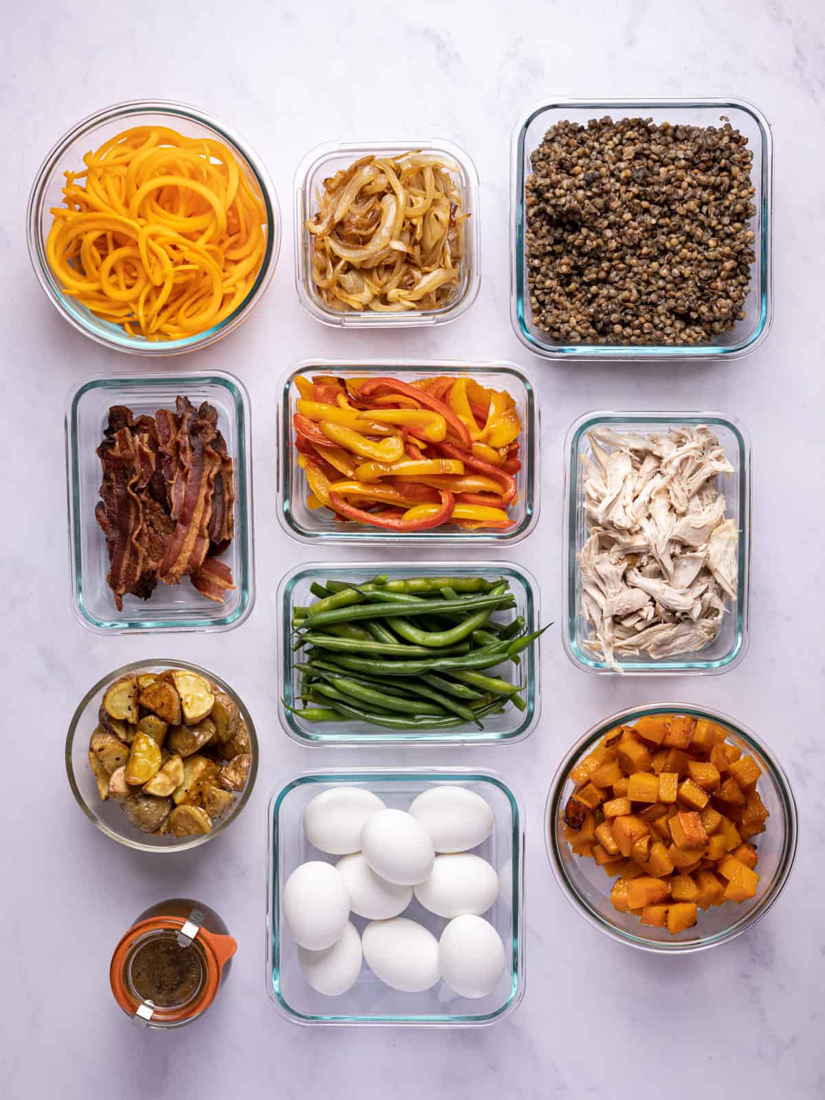 overhead of fall meal prep ingredients in glass containers