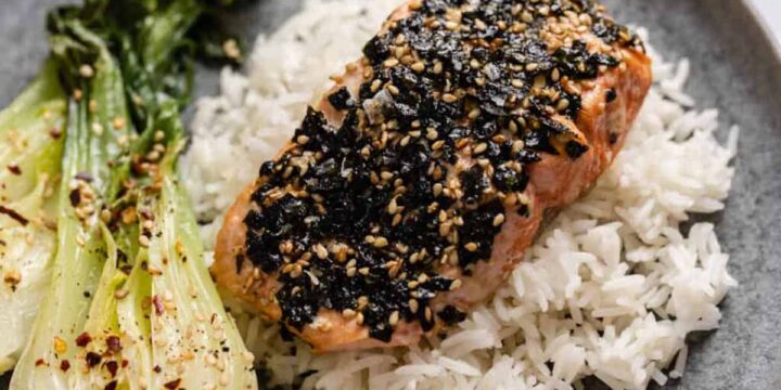 Furikakae salmon on a bed of white rice with a side of bok choy.